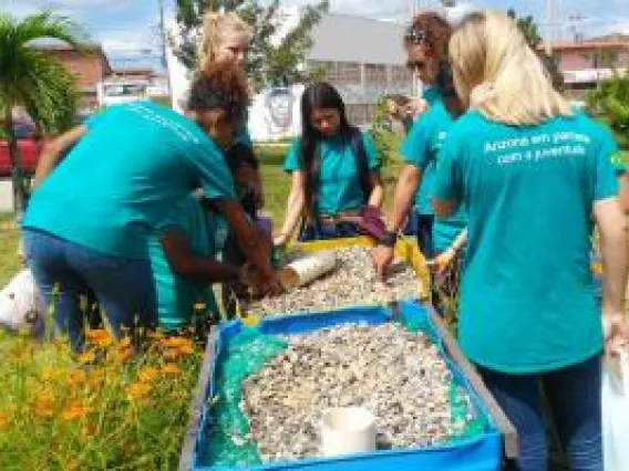 Students volunteering outdoors.