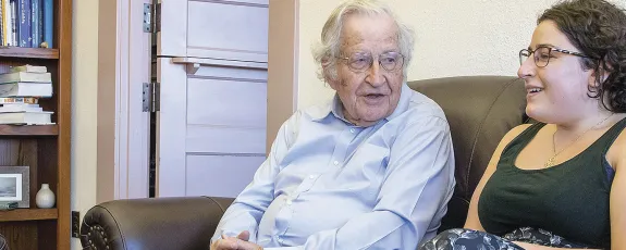 Graduate student chatting with UA Professor Noam Chomsky Graduate student chatting with UA Professor Noam Chomsky
