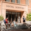 four students in front of the Social Sciences building